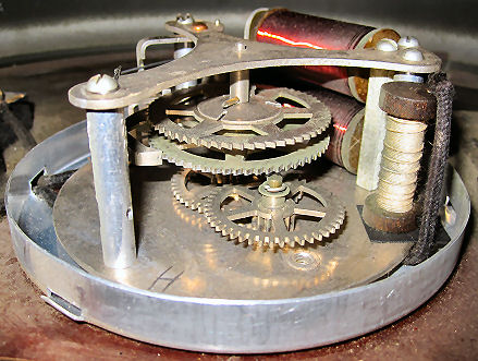 The Standard Electric Time Company clock has a shunt resistor wired in parallel with the electromagnets to absorb the voltage spike.